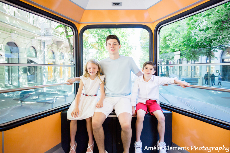 family photographer Zurich Switzerland Amelie Clements photo-shoot city center photoshoot swiss american expat children in tram portrait